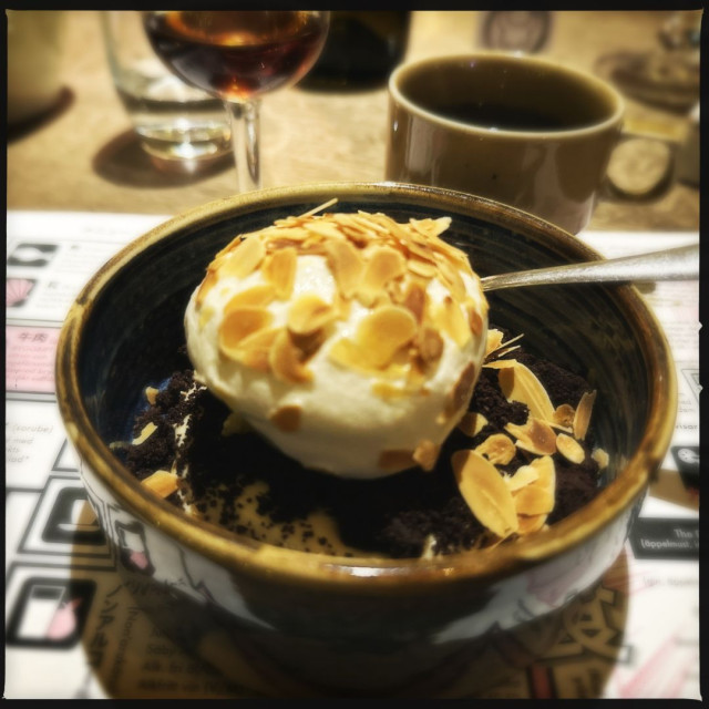 Dessert, a glass of rum and a coffee.