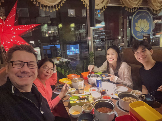 My family eating Chinese hot pot.