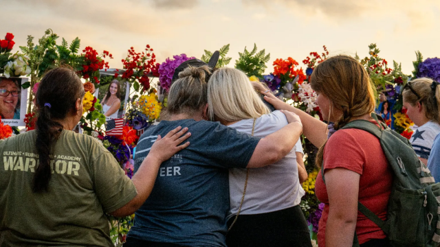 Community members gather during a candlelight vigil to honor the lives lost in the flash floods that claimed more than 120 lives on July 11, 2025 in Kerrville, Texas. More than 160 people are still missing after storms cells halted over the area, dumping nearly 15 inches of rain and causing a 22-foot rise along the Guadalupe River. (Photo by Brandon Bell/Getty Images)