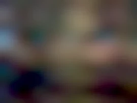 Image of protesters gathered with placards and banners in Trafalgar Square