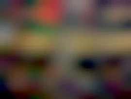 Protesters with Palestinian flags holding candles at a gathering in Trafalgar Square