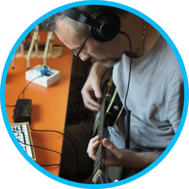 Chris Randall recording a guitar track.