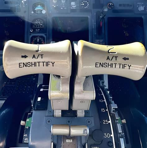 Commercial airline throttle levers, but they both say ENSHITTIFY.