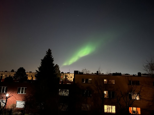 A bright green stripe on the sky