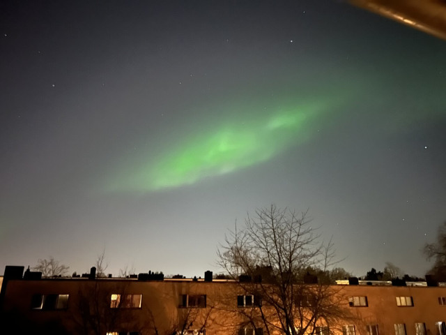 A bright green stripe on the sky