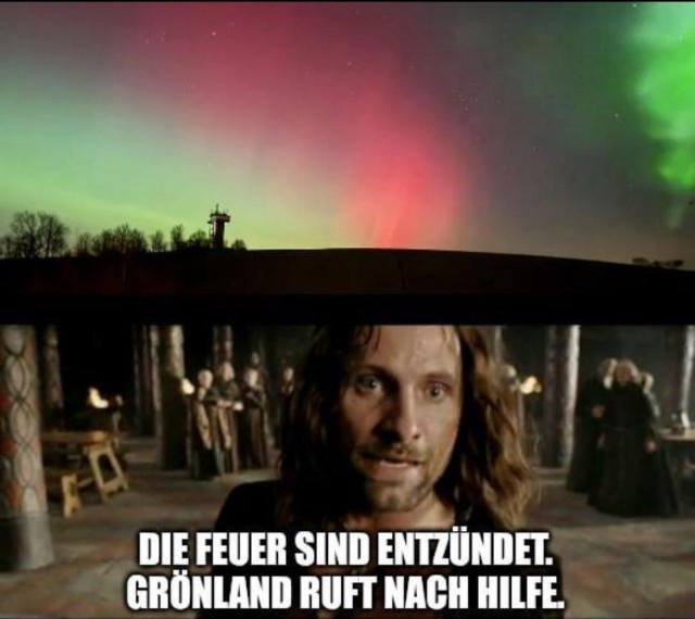 This meme is a two-panel image. The top panel depicts a vibrant Aurora, or Northern Lights, illuminating a dark night sky with streaks of green and red light. Below the celestial display, a dark landscape with silhouetted trees and a distinct tower-like structure is visible, suggesting a dramatic and urgent visual of "fires being lit" across a vast expanse. 

The bottom panel features a still from the movie "The Lord of the Rings: The Return of the King." The character Aragorn is prominently shown looking forward with a serious and concerned expression. In the background, other figures are faintly visible, suggesting a gathering or a moment of tension. 

Superimposed over the bottom panel in white, bold text are the German words: "DIE FEUER SIND ENTZÜNDET. GRÖNLAND RUFT NACH HILFE." This translates to "THE FIRES ARE LIT. GREENLAND CALLS FOR AID." 

The meme's humor comes from its adaptation of a famous line from "The Lord of the Rings," where Aragorn exclaims, "The Beacons of Minas Tirith! The Beacons are lit! Gondor calls for aid!". The original quote refers to a system of signal fires used to summon allies in times of war. By replacing "Gondor" with "Greenland," the meme humorously applies this epic call for help to Greenland, referencing fascist USA's longing to own the country. The visual of the Aurora Borealis in the top panel serves as a dramatic and visually striking representation of the "fires being lit," enhancing the meme's comedic and epic tone.