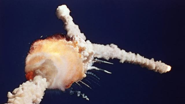 In this Jan. 28, 1986 file photo, the space shuttle Challenger explodes shortly after lifting off from the Kennedy Space Center in Cape Canaveral, Fla. (AP Photo/Bruce Weaver, File)