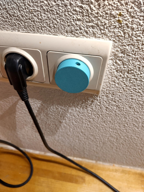3d printed teal knob replacing the old one on dimmer. 