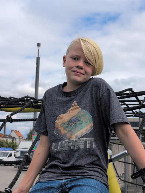A child wearing a Luanti t-shirt