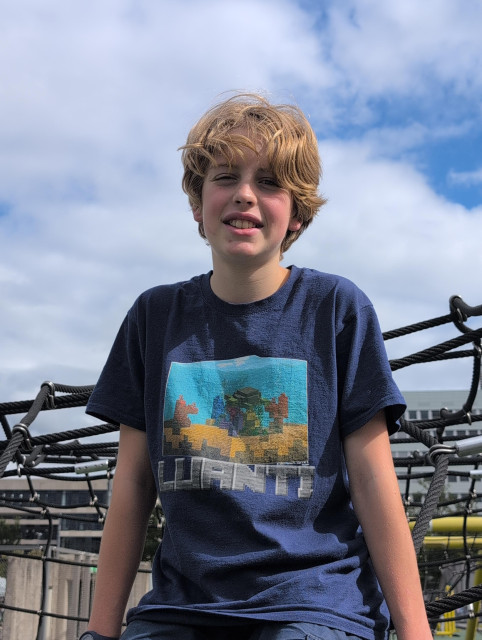 A child wearing a Luanti t-shirt