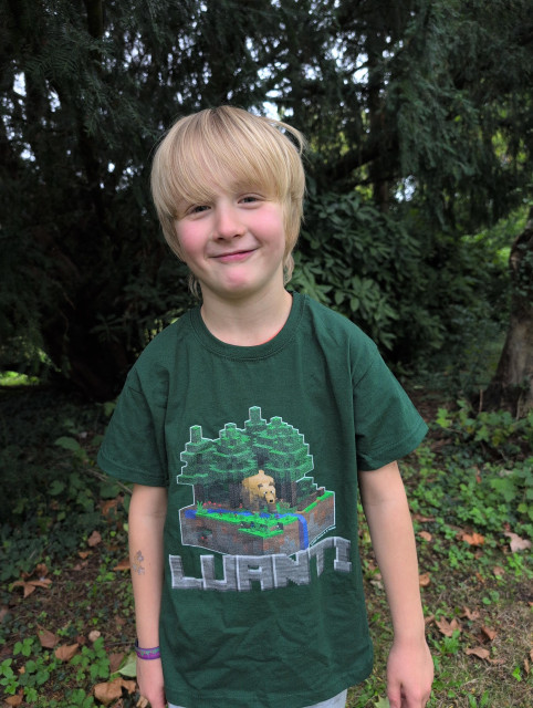 A child wearing a Luanti t-shirt