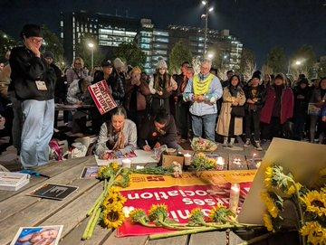 Crowds gather to lay cards, flowers and messages of condolence