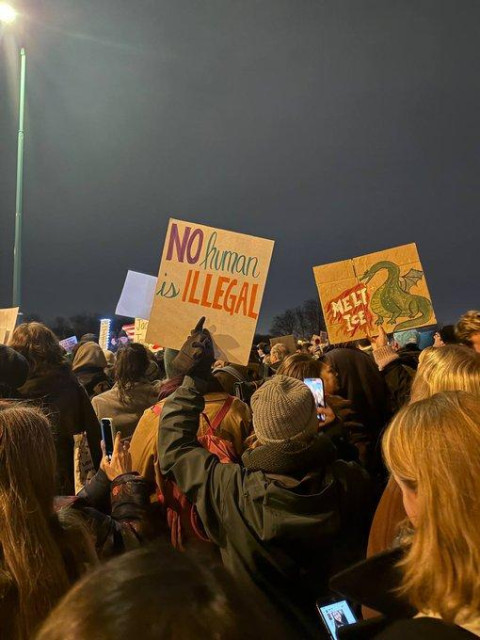 Crowds gather in Paris, holding signs reading MELT ICE and NO HUMAN IS ILLEGAL