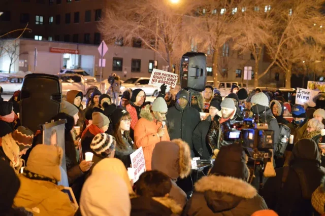 Large crowd with candles gathered in Chicago