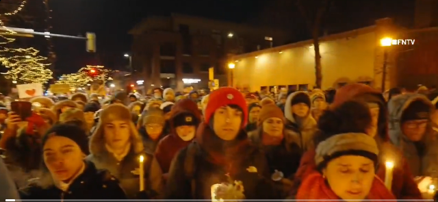 Huge crowd with candles gather to remember Alex.