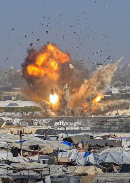 .This picture sums up what happened today… Bombing among the tents, where there are no houses or shelters,

only families trying to survive with what little life they have left.

My wife and I sit together, waiting for the unknown.

We cling to each other, leaving no one behind…

Not even our unborn child,

for whom I beg your help in securing the necessities for his birth,
so that if anything happens to us, we may die together.