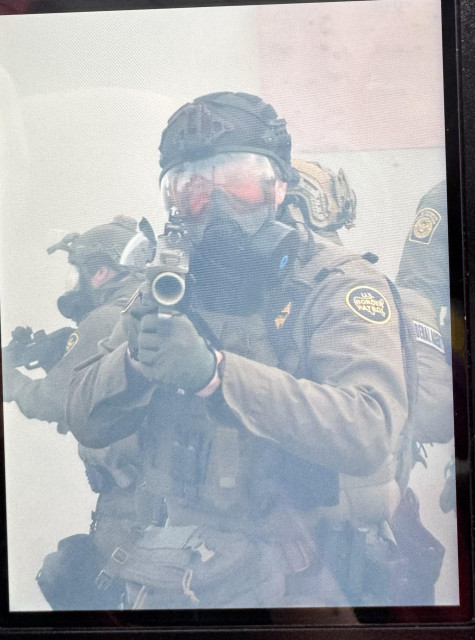 Fed pointing weapon at face 