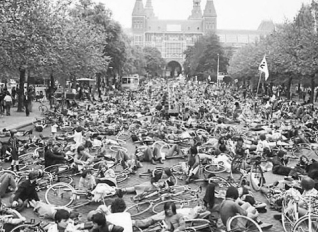 A black and white picture shows thousands of bicycles laid down in the city of Amsterdam end of 1970s.