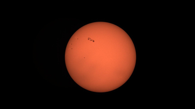 Image of the Sun showing sunspots and solar activity against a black background.