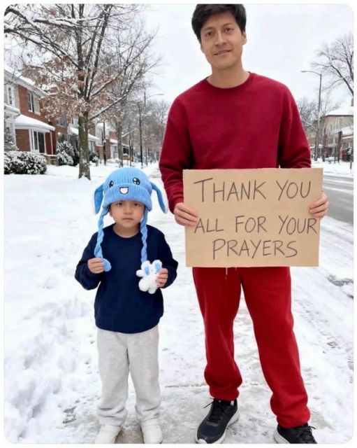 Liam - a five year od child -- is on the left, wearing a bunny hat. His father is on the right, holding a sign that says "thank you for your prayers". 
