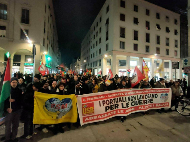 Striking dockworkers march through Livorno