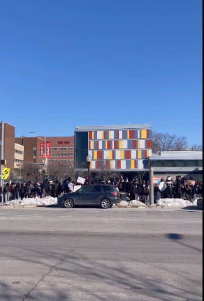 A column of students line the pavement to protest against ICE in Baltimore
