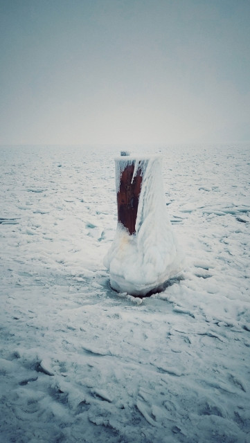 A part of a ship quay in frozen Baltic Sea.