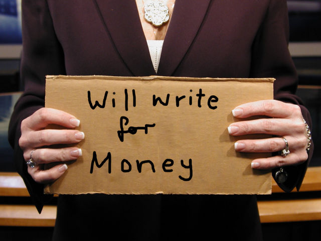 Photo of a woman holding a cardboard sign that reads "Will write for money".
