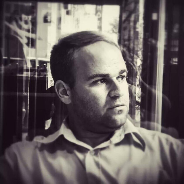 Me, looking out. A b/w photo from 2014, in Paris. Indoor, thinking about the future. Reasoning about what to do. Positive.