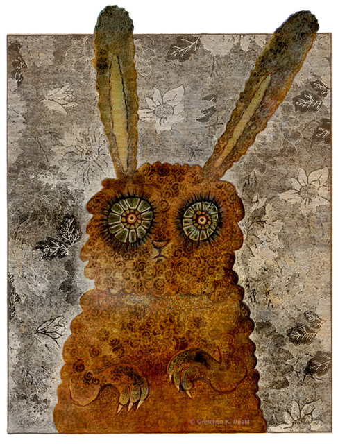Colorway #2
Textured colors of spotted, mottled brown, green and green. An ink drawing of a rabbit-like creature stares with distress and wonder outward. It has a  small nose and mouth.  Its clawed arms hang protectively in front of it.