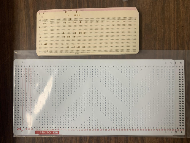 IBM-format 80-column/12-row punch cards in EBCDIC and Silver Reed 60-column/25-row punch cards.