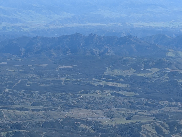 Pinnacles National Park from 5500 feet. The mountains are sharp, jagged rocks which stick up from the surrounding terrain.
