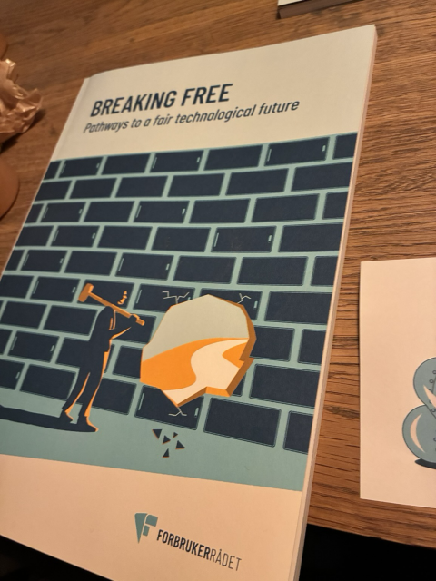 Picture of a report on a table. Breaking free - pathways to a fair technological future.