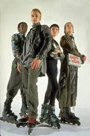 The cast of Hackers on rollerblades 