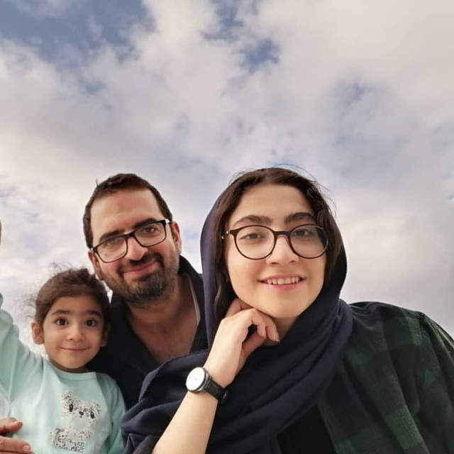Editor Nima Rajabpour pictured with his daughter's before his death at the hands of Israel.
