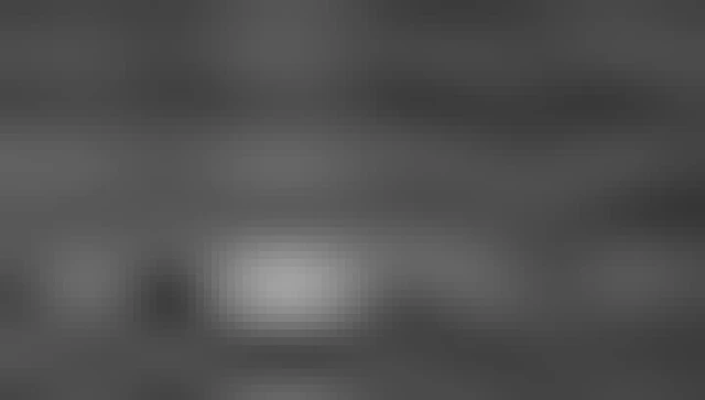 A series of research station buildings with the polar landscape in the back.