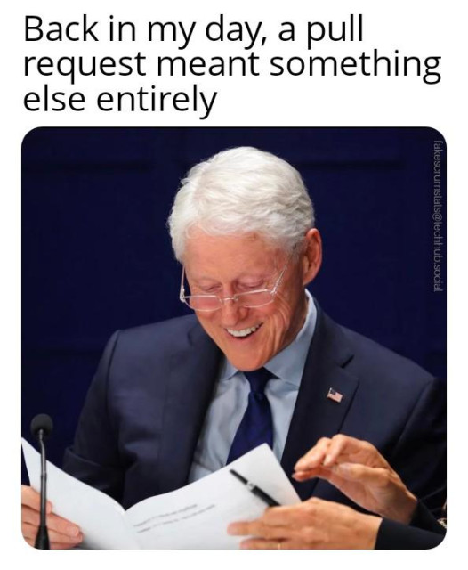 A photo of Bill Clinton smiling while looking at some papers.

Caption: Back in my day, a pull request meant something else entirely 