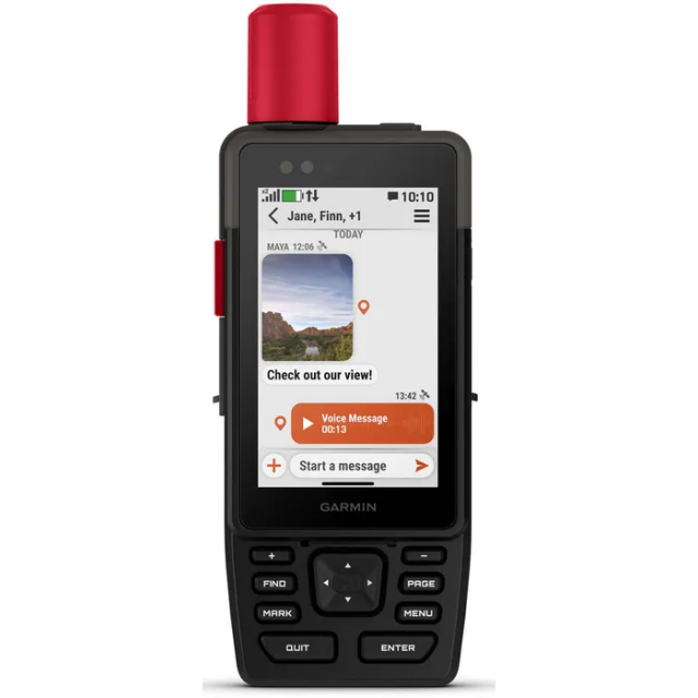 A black Garmin handheld GPS and satellite communicator with a red antenna on top, shown against a plain light background. Its color screen displays a messaging interface with a photo thumbnail, a text saying “Check out our view!”, and an orange voice message bubble, while physical navigation and function buttons fill the lower half of the device.