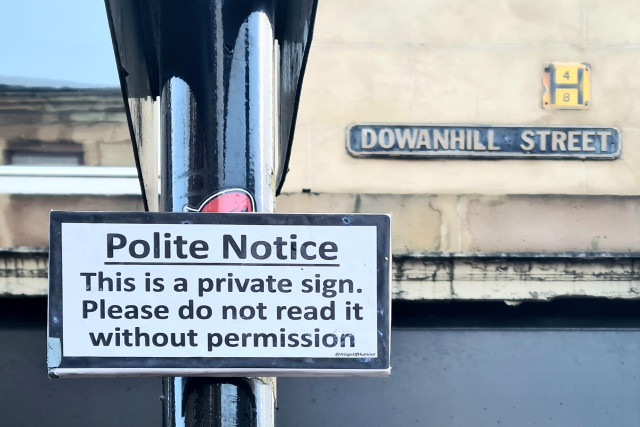 A sign which reads Polite Notice. This is a private sign. Please do not read it without permission.