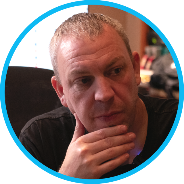 Dan Korneff in front of a computer screen.