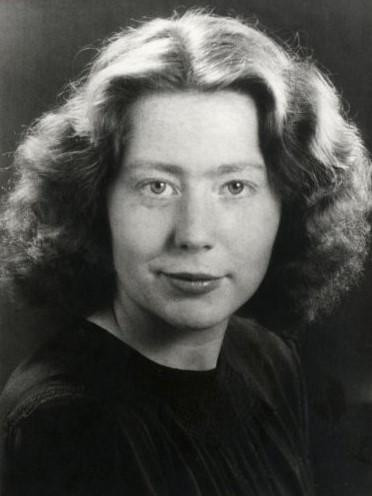 black and white studio photo of Hannie Schaft. She is a white woman with light hair.