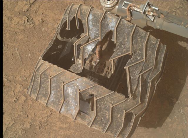 An heavily worn out wheel of the Mars rover Curiosity.