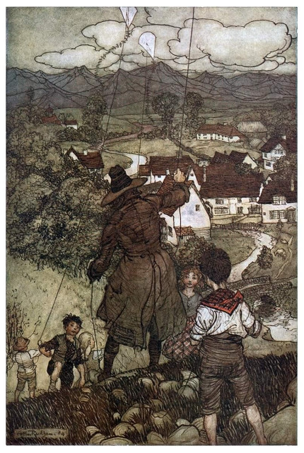 A man in a weathered colonial frock coat and a hat is seen from behind, flying a kite with children on the hillside overlooking a nearby village.
