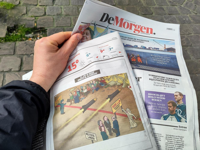 Photo showing newspaper De Morgen with my cartoon in print.