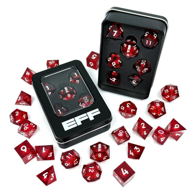 A collection of red liquid core dice scattered around a metal tin with the EFF logo
