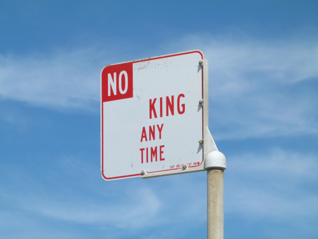 a street sign edited to say NO KING ANY TIME