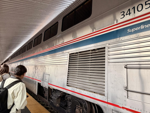 A photo of an Amtrak Superliner car at a platform 