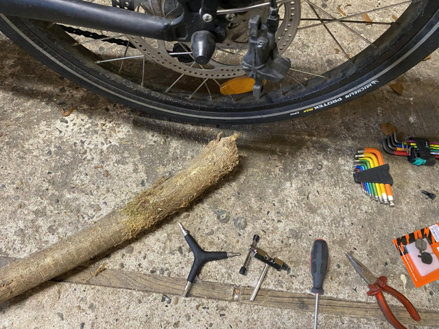 Tools and back wheel of the bike. Visible are the terrible Bengal brake pads (a bit too worn, I do admit)