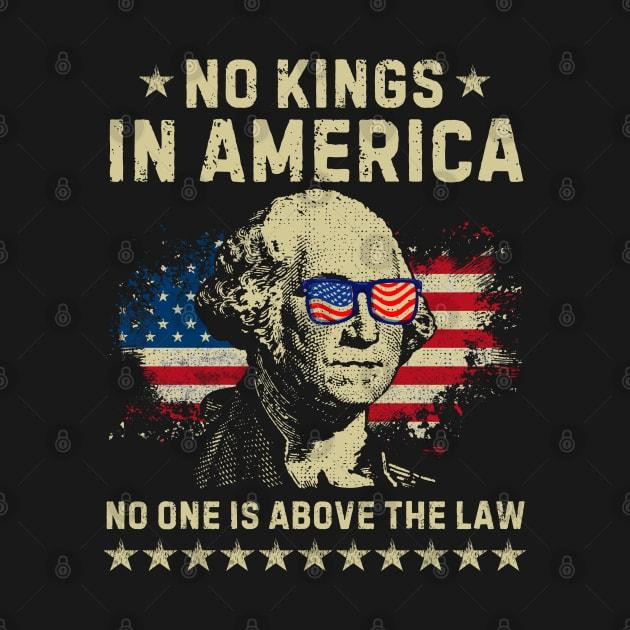 A t-shirt design from Teepublic.com showing George Washington's face (with sunglasses with the American flag on them) over another flag with the text, "NO KINGS IN AMERICA, NO ONE IS ABOVE THE LAW" over a line of stars.  