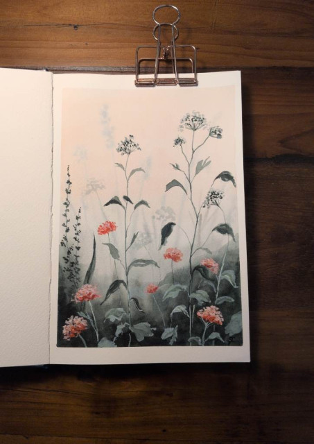 This is a watercolor painting of botanicals painted against a peach sky and grounded in dark green foliage. Some of the botanicals blur into the background. Some of the flowers look like Queen Anne's Lace. The taller stalks are pale blue with some dark dotting and other shorter stalks are corally pinks flowers of the same variety.
